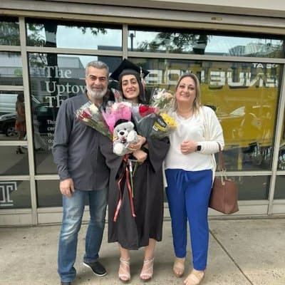 Christine Natsah with family at a graduation